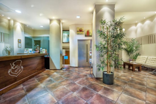 a lobby with a few plants