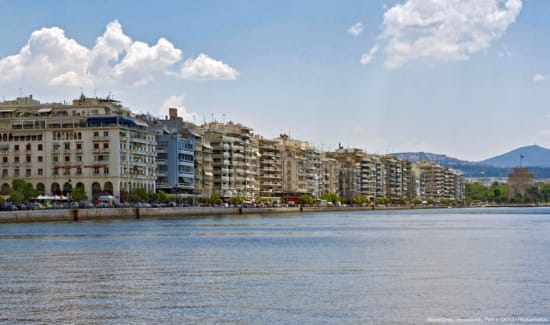 a body of water with buildings along it