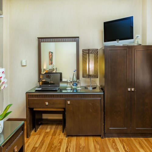 a room with a tv and a cabinet