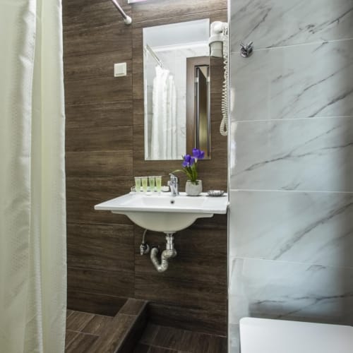a bathroom with a sink and a mirror