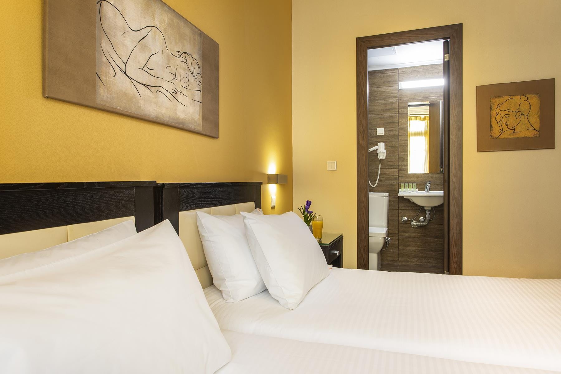 a hotel room with two beds