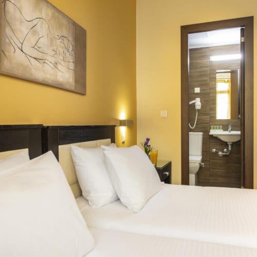 a hotel room with two beds