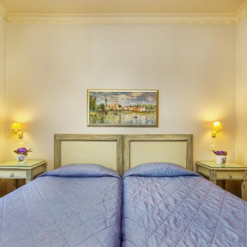 a bedroom with two beds