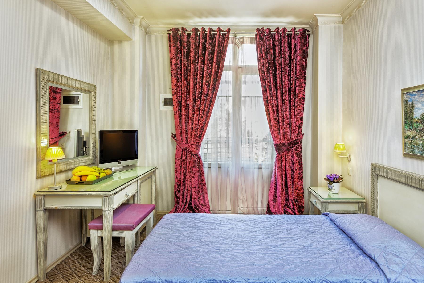 a bedroom with a bed and a desk