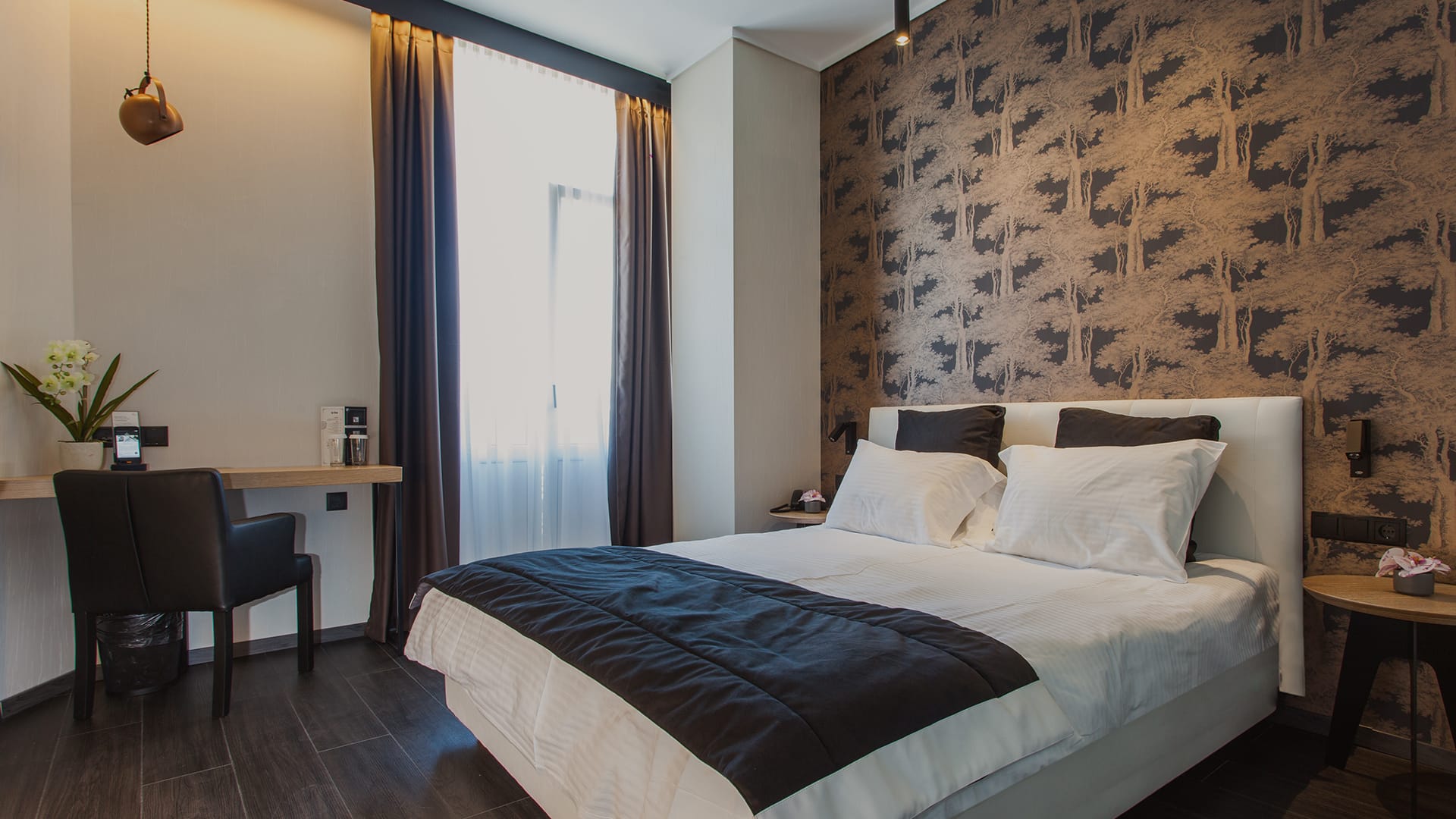 a bedroom with a bed and desk