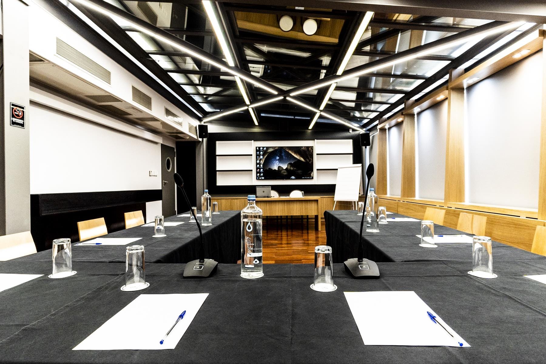 a table with glasses and papers on it