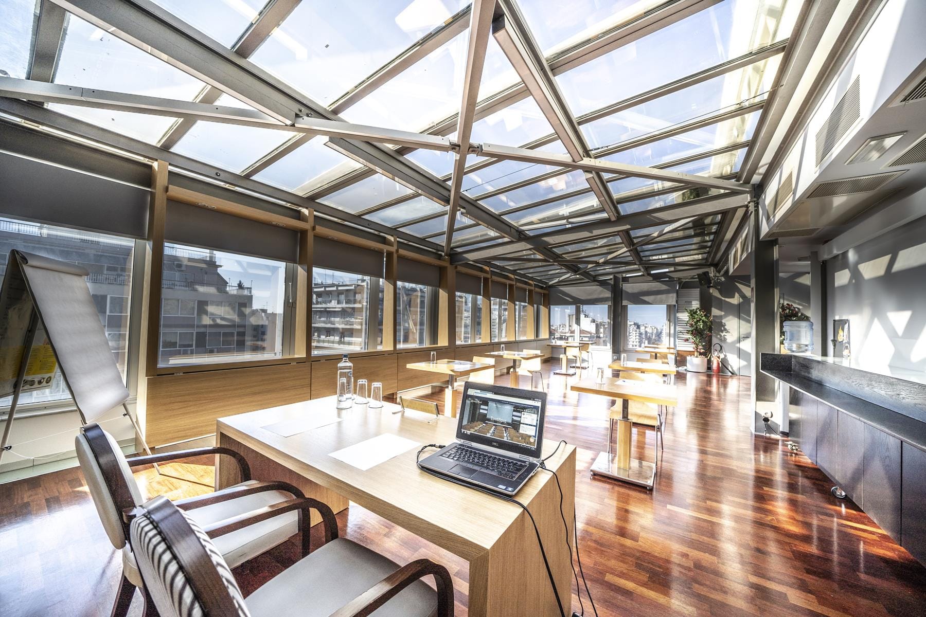 a room with a desk and a laptop