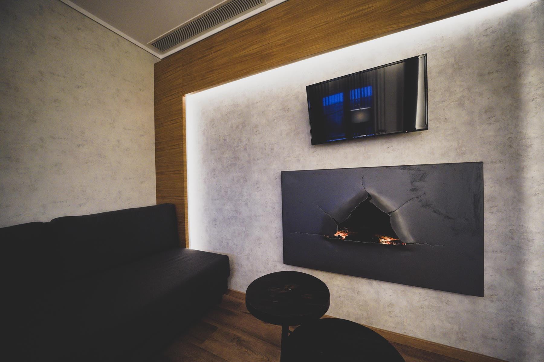 a room with a fireplace and a tv