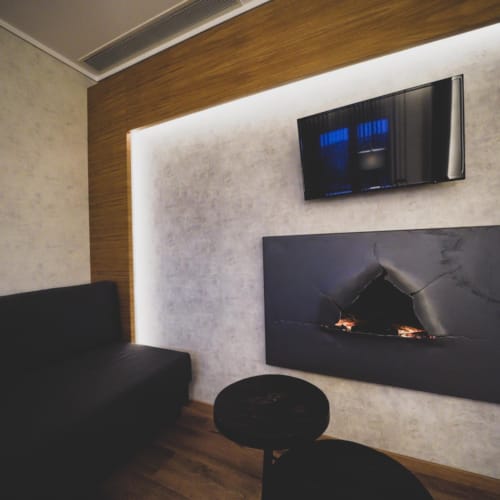 a room with a fireplace and a tv
