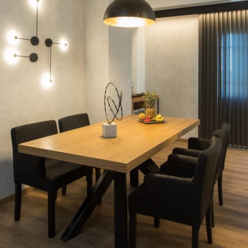 a dining table with chairs around it