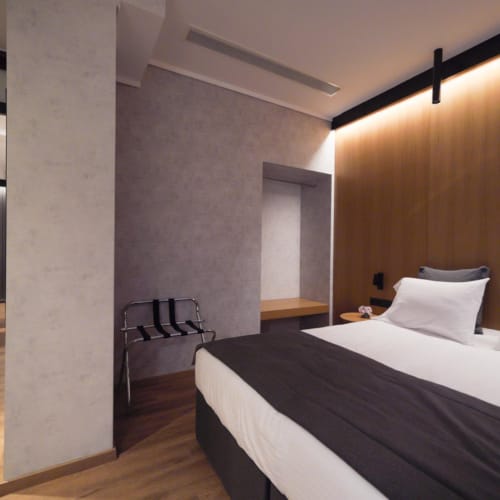 a room with a bed and a desk