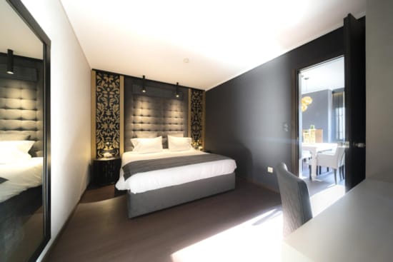 a bedroom with a large mirror