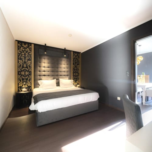 a bedroom with a large mirror