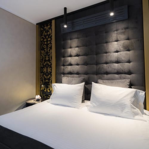 a bed with white sheets