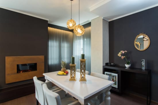 a dining room with a table and chairs