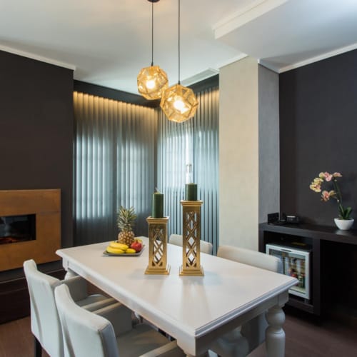 a dining room with a table and chairs