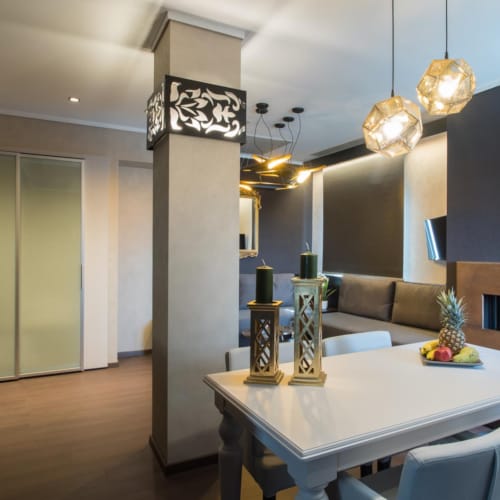 a dining room with a table and chairs