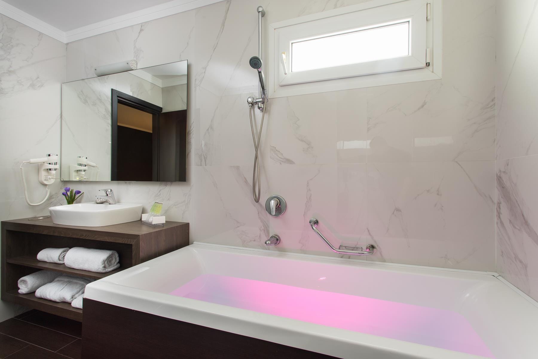 a bathroom with a tub and sink