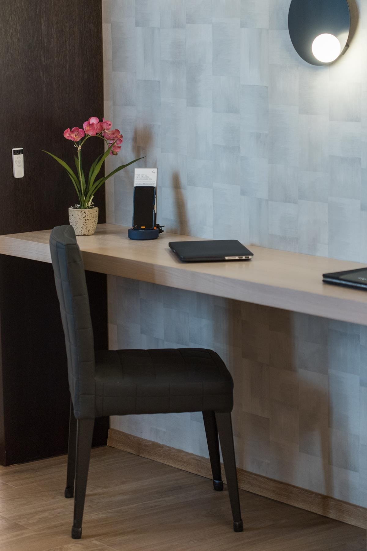 a desk with a chair and a plant on it