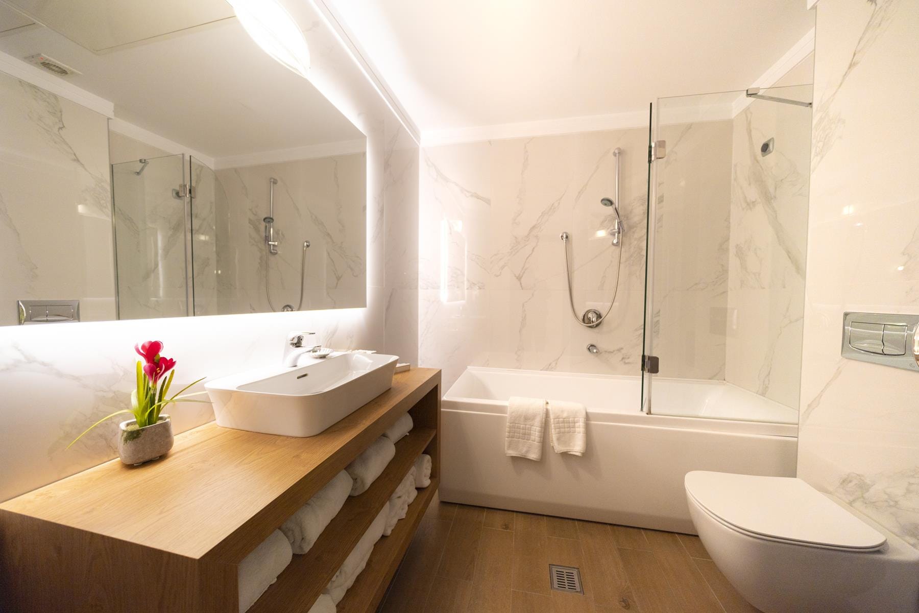 a bathroom with a tub sink and toilet