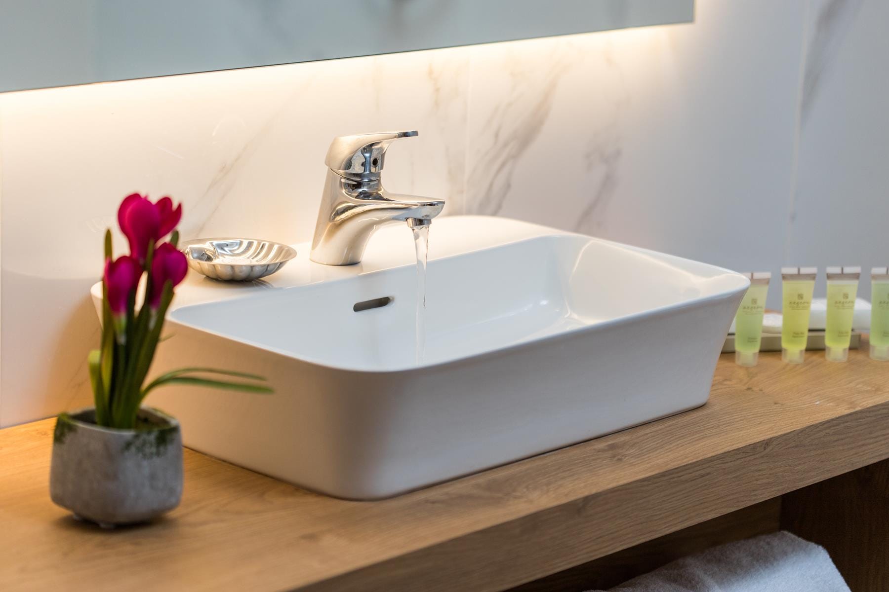 a sink with a flower in it