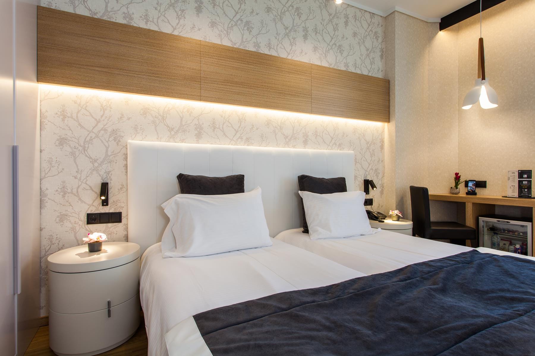 a bed with a white headboard