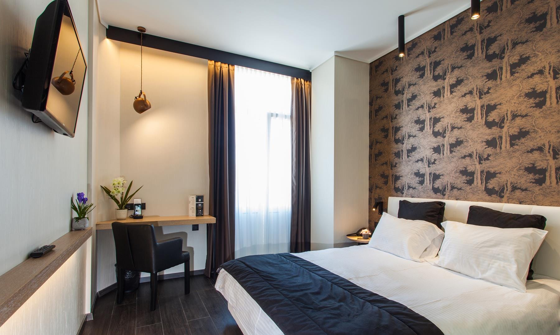 a bedroom with a bed and a desk