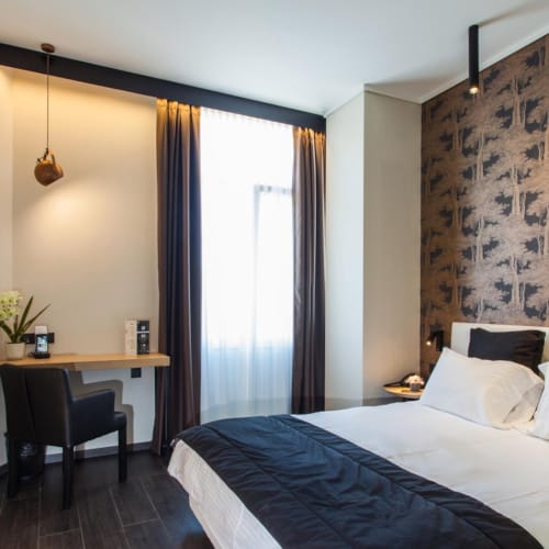 a bedroom with a bed and a desk