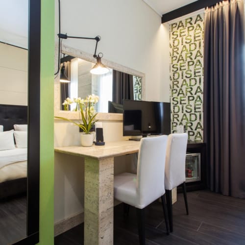 a room with a desk and a bed