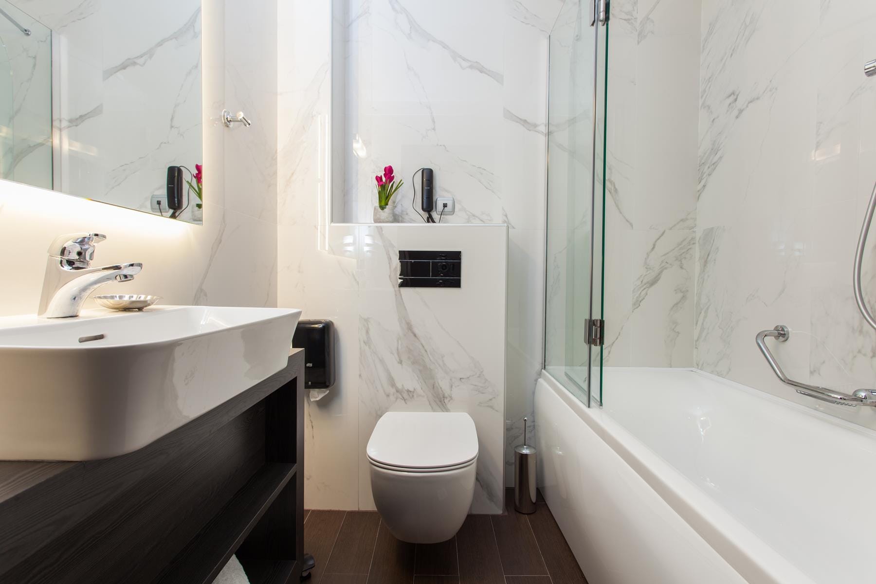 a bathroom with a tub toilet and sink