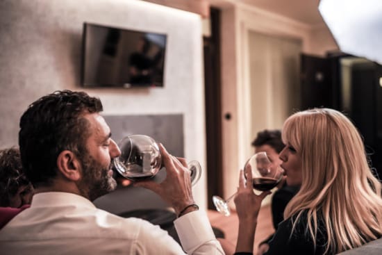 a person drinking wine