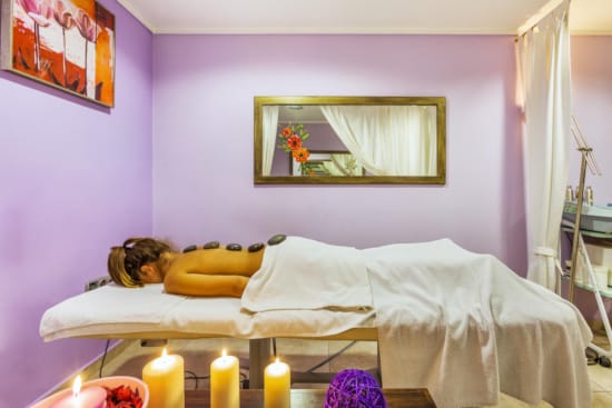 a cat laying on a bed