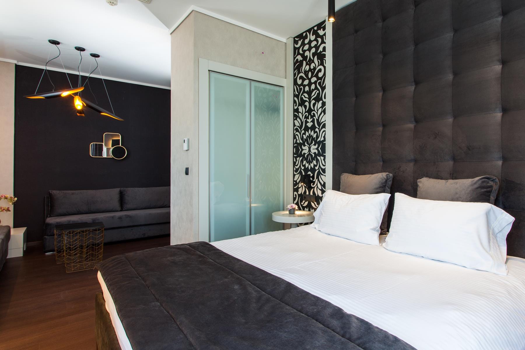 a bedroom with a bed and a bench