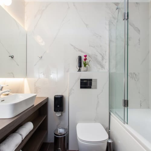 a bathroom with a toilet and sink