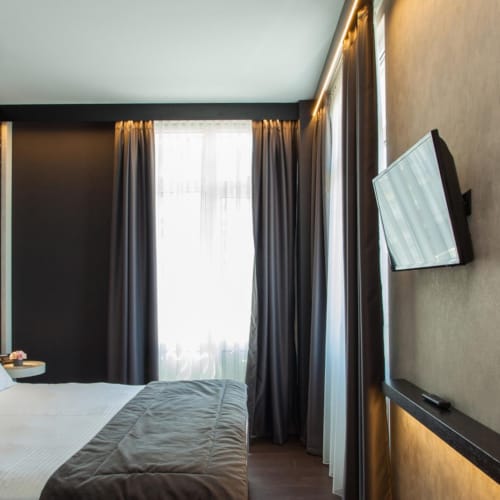 a bedroom with a large mirror