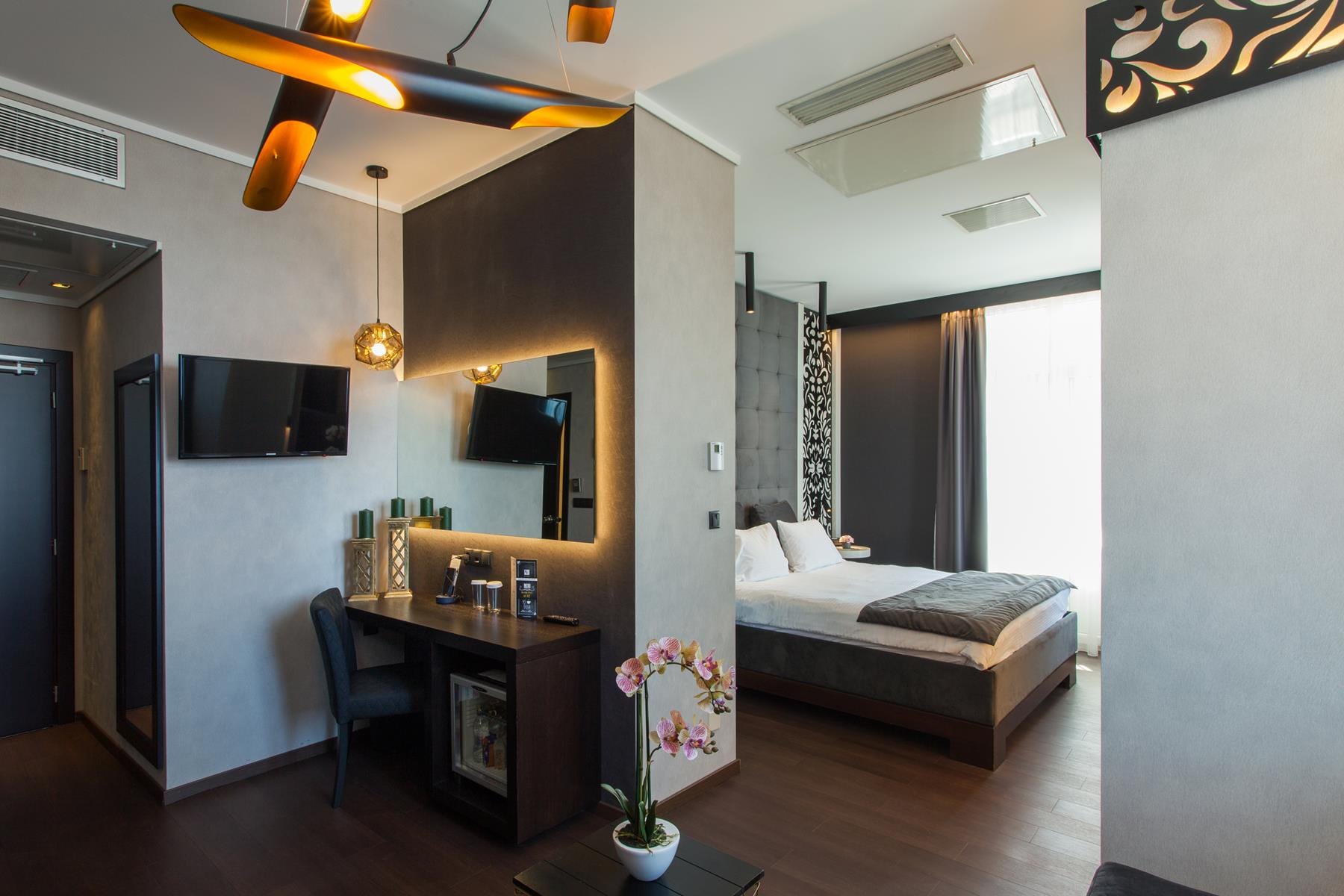 a bedroom with a bed and a desk