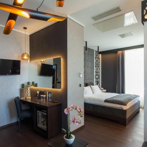 a bedroom with a bed and a desk