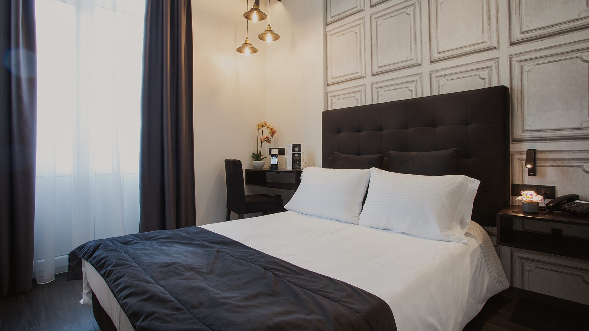 a bed with a black headboard