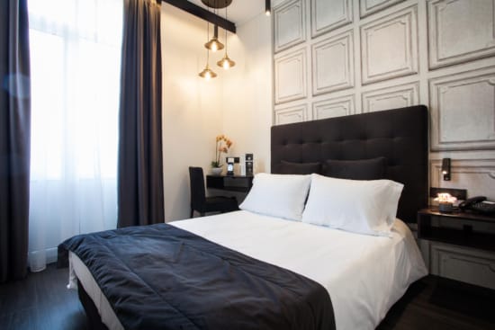 a bed with a black headboard