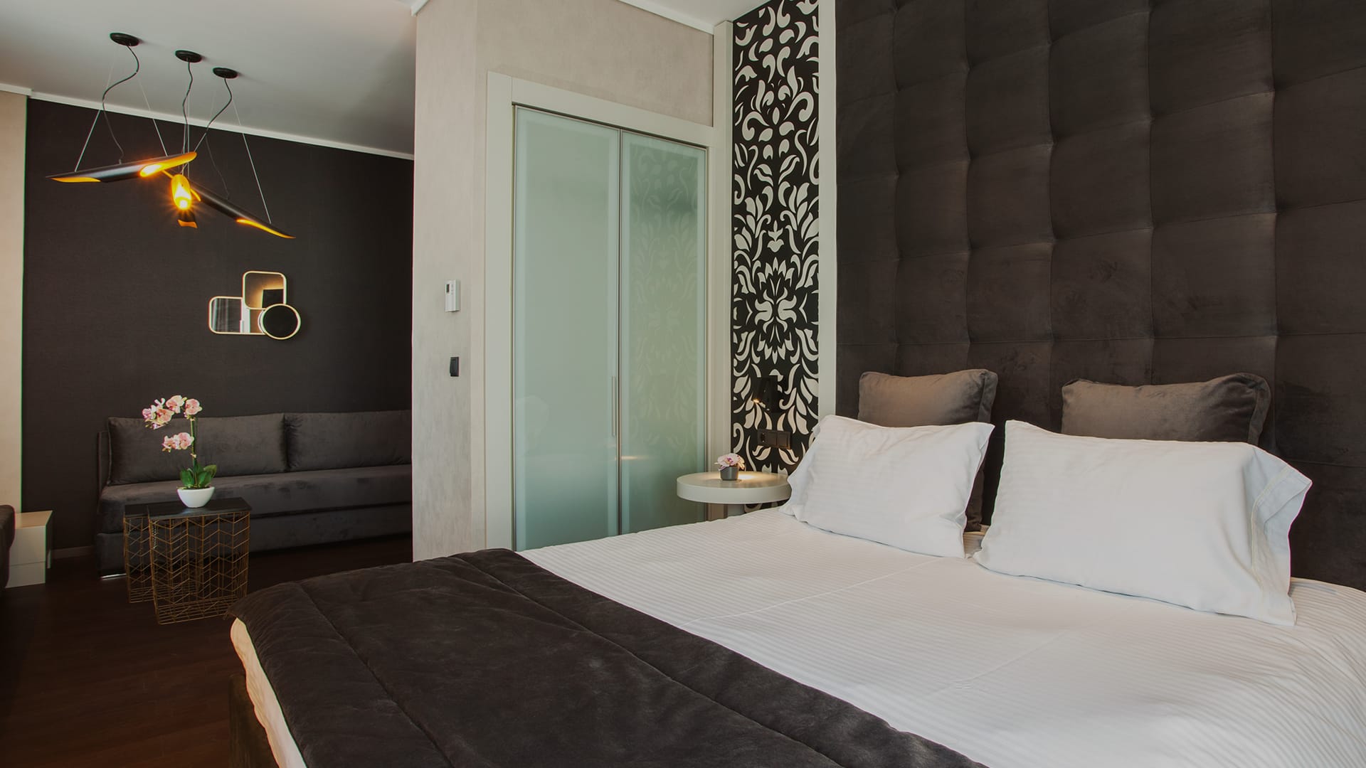 a bedroom with a bed and a couch