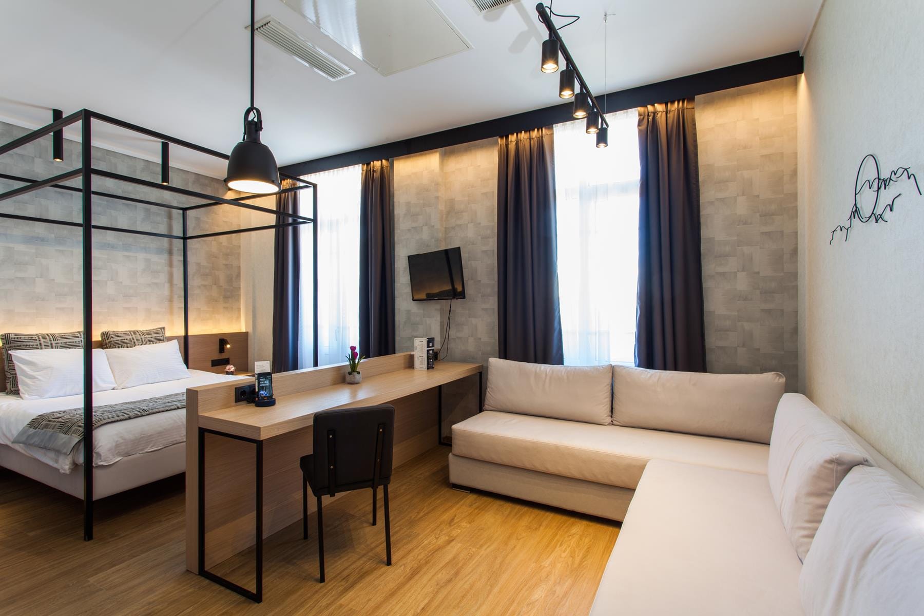 a bedroom with a bed desk and a bed