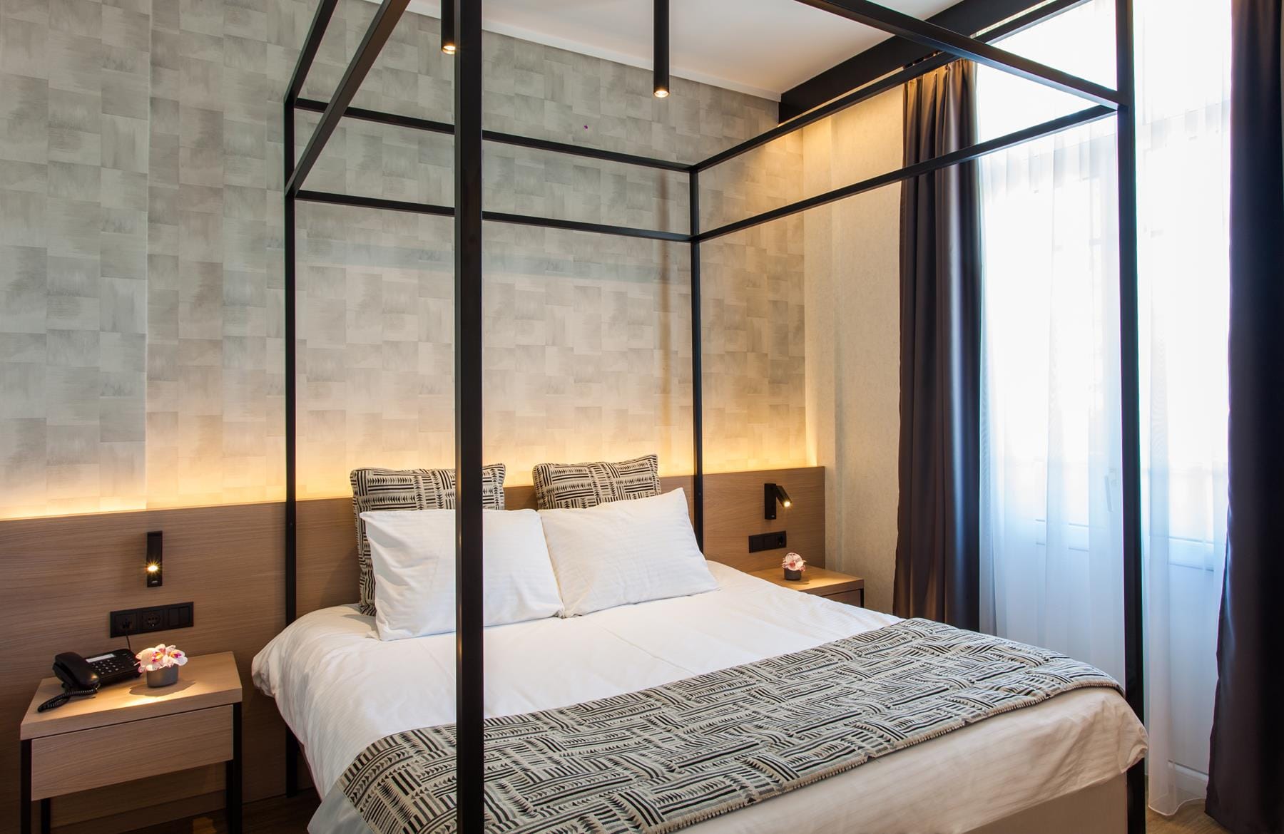 a bed with a large window