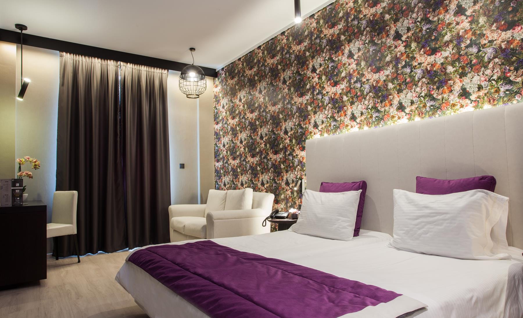 a bed with a purple blanket