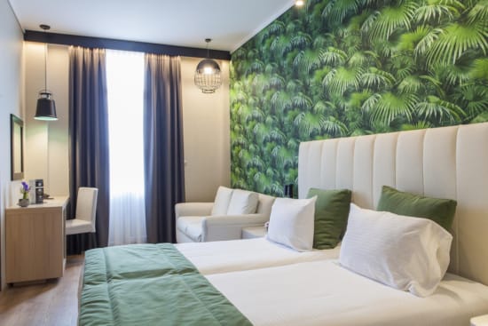 a bedroom with a bed and a chair