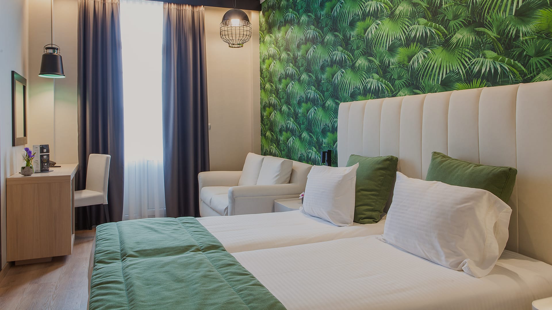 a room with a bed and chairs