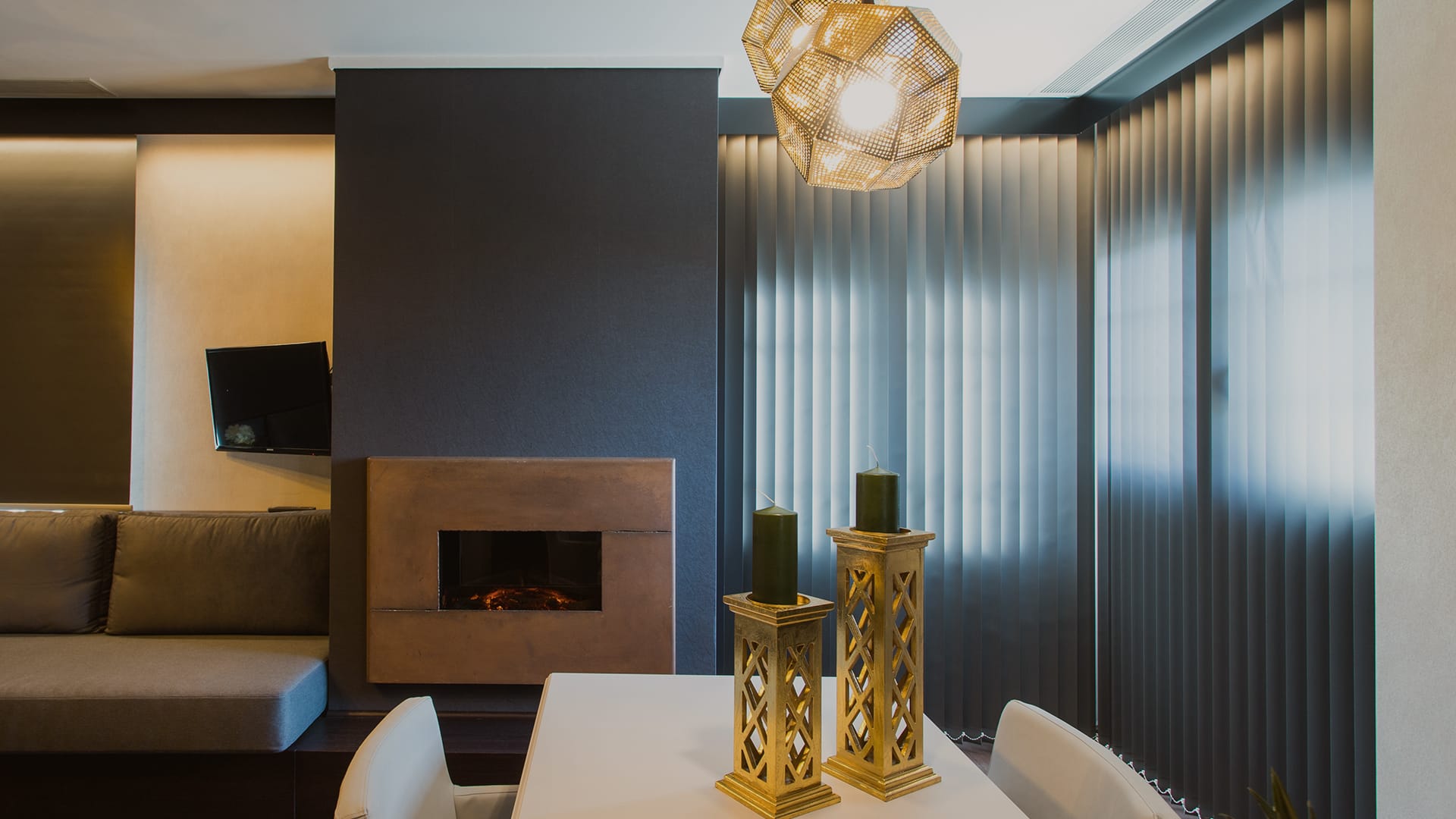 a room with a fireplace and a table with a vase on it