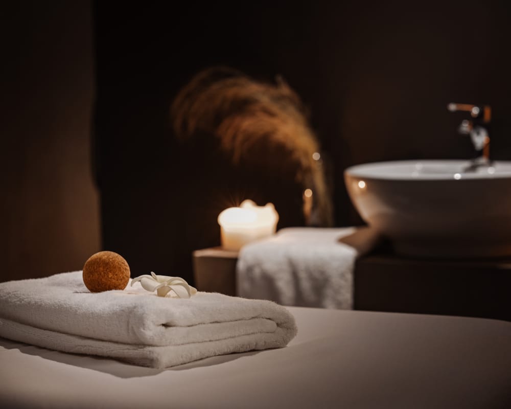 a person sitting at a table with a plate of food