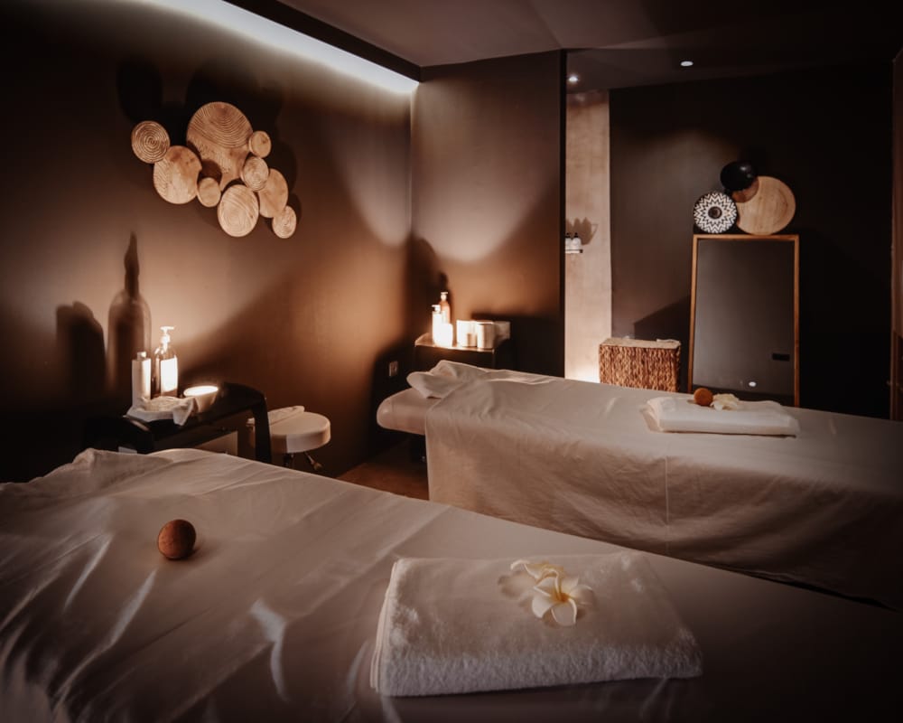 a hotel room with two beds