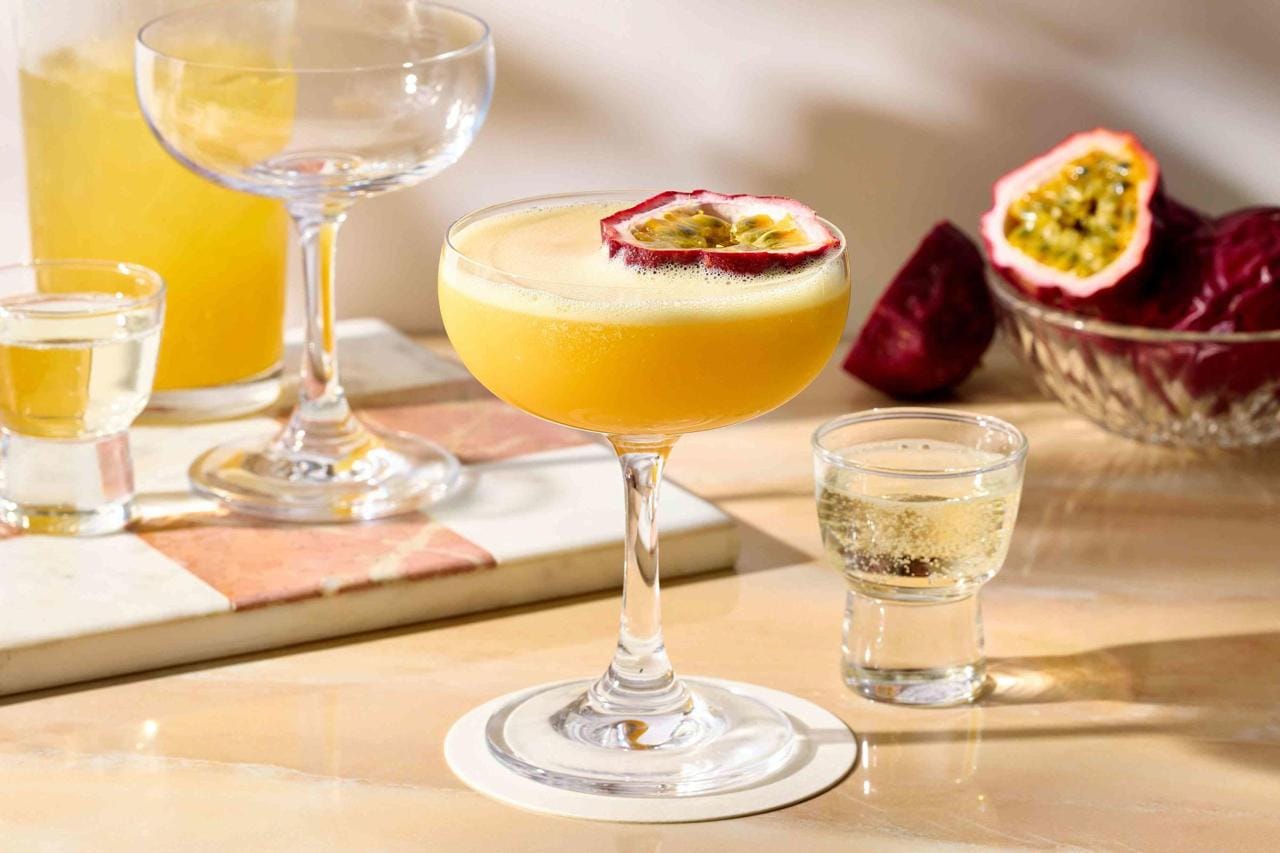 a group of glasses with fruit in them