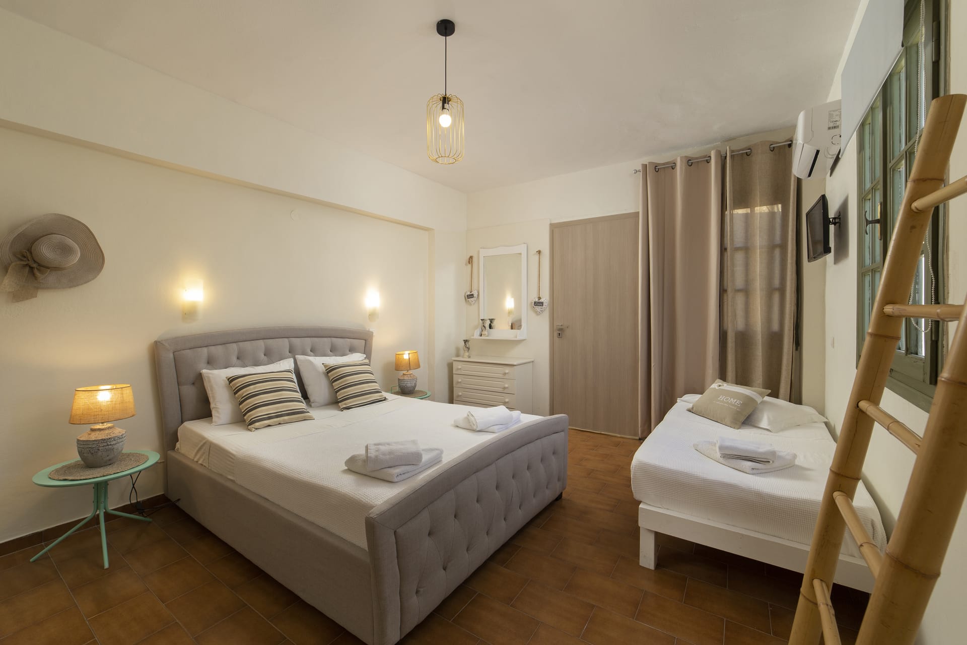 a bedroom with a bed and a ladder